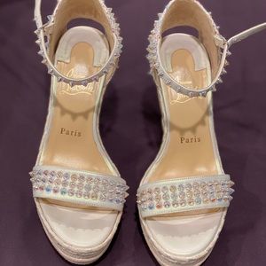 Christian Louboutin spiked wedges Size 38
Ivory